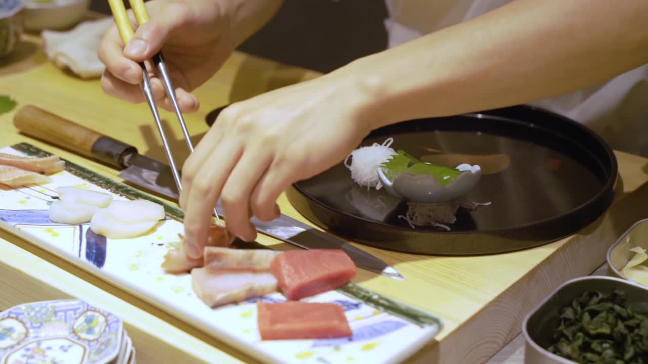 Chef Preparing Side Dishes For Sushi In A Chinese Restaurant In Guangzhou, China - close up