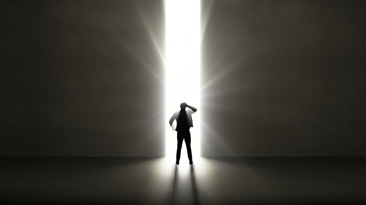 창문을 통해 빛을 비추는 사업가