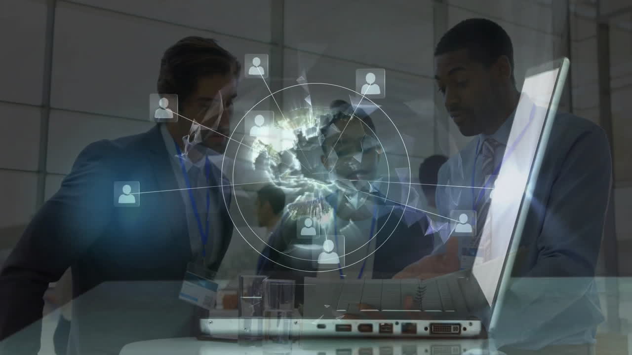 Business professionals networking at tech event with laptop, examining holographic network overlay