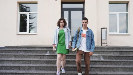 Two-friends-talking-outside-the-high-school