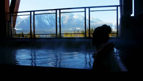 Woman-relaxing-in-swimming-pool