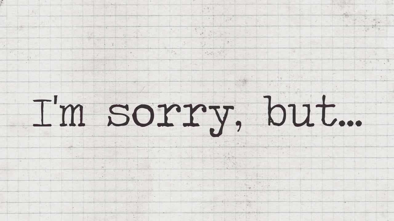 Typewriter characters appearing on an old paper sheet, composing the phrase: I'm sorry, but