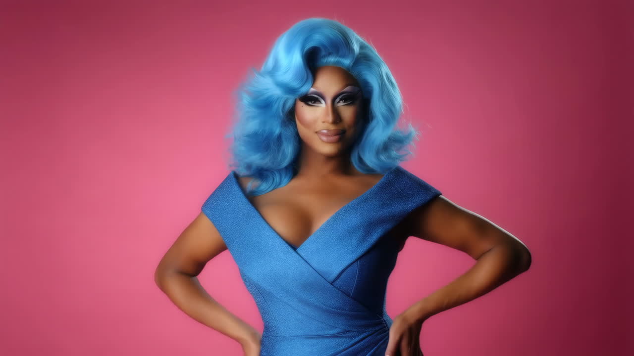 Glamorous Drag Queen Portrait with Blue Hair and Dress on Pink Background