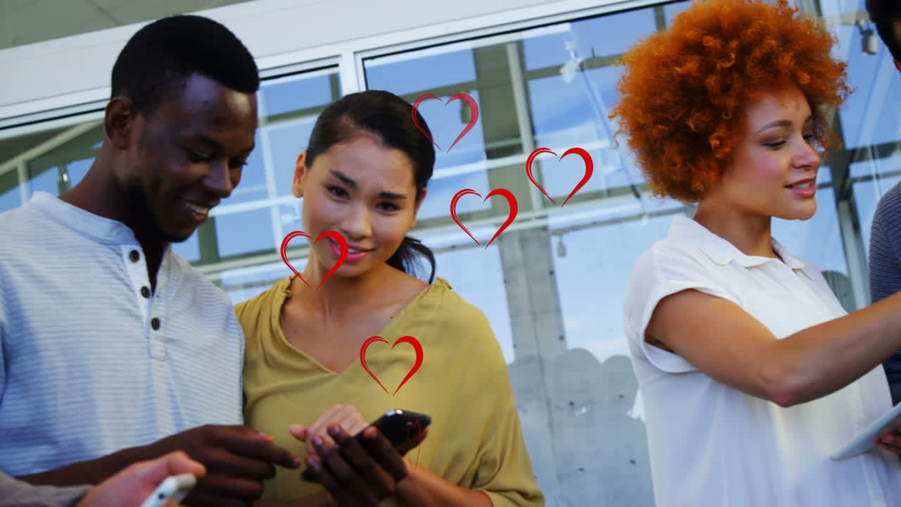 Animation of falling hearts over diverse group of business people