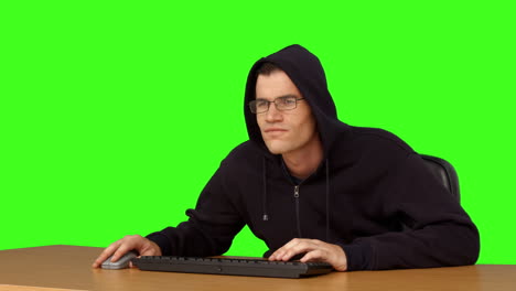 hacker typing at his desk