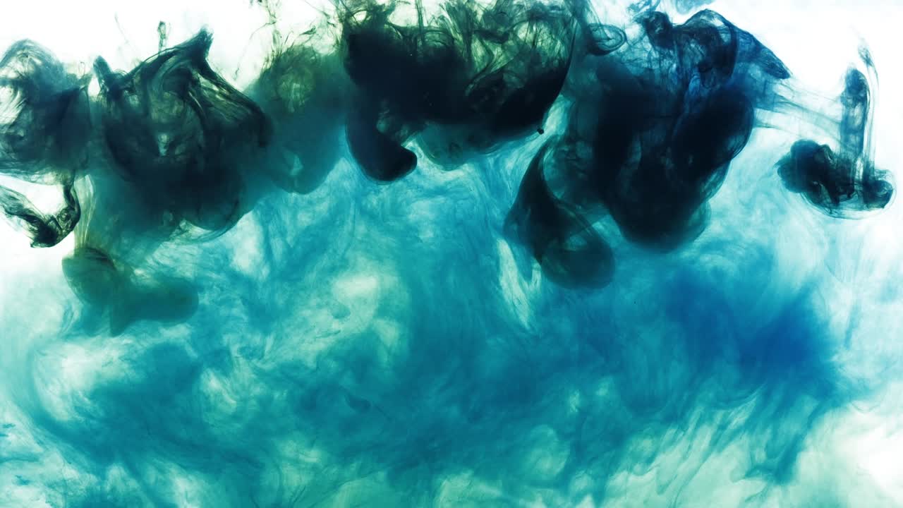 4K footage of green and blue colorful ink drops in water, isolated abstract background. Pouring ink in water. Underwater paint mix. Slow psychedelic dye swirls, colored smoke explosion. Splashing, floating liquid