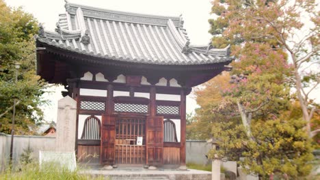 slide shot of an old temple in kyoto, japan 4k slow motion, left to right