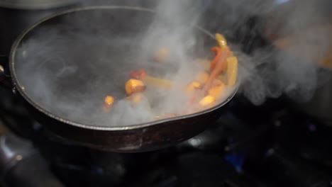 cooking vegetables in a steaming cooking pan in slow motion