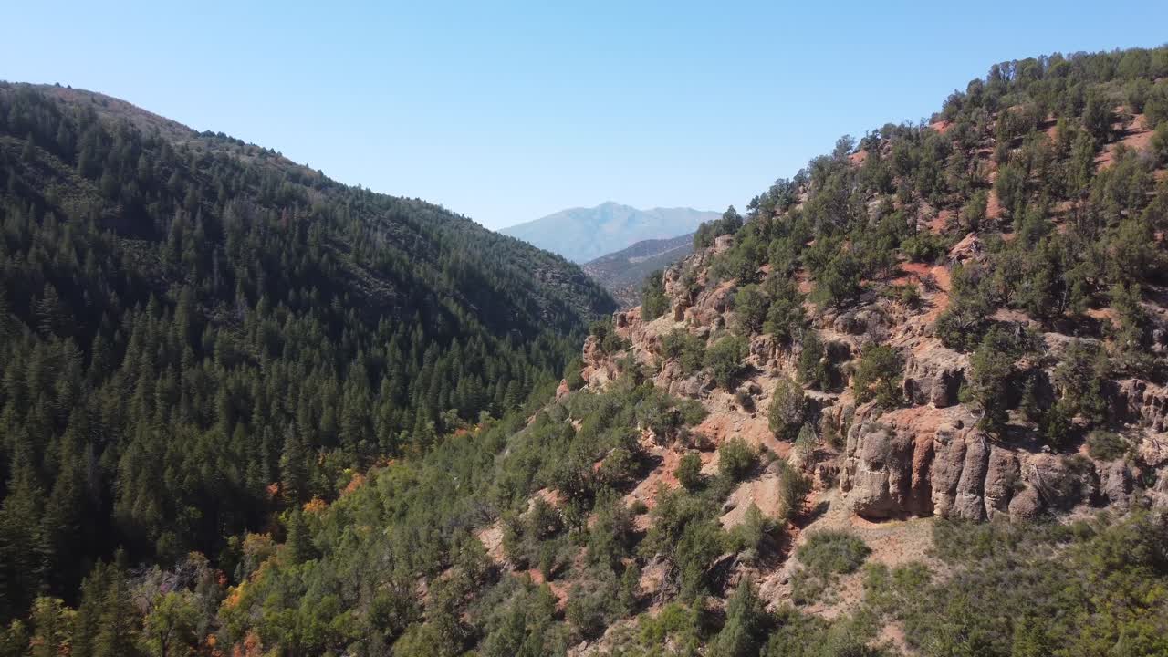 Aerial clip of Utah’s mountain terrain and trail heading to natural hot pools. Perfect for documentaries, travel films, and outdoor projects