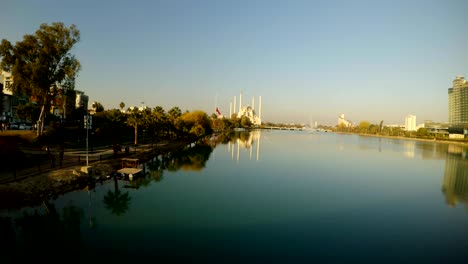 bridge to the river seihan and sabancı merkez mosque in the center of adana bright sunny day