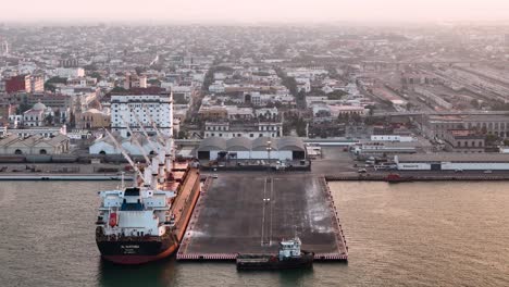 aerial view of a port city at sunset