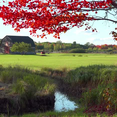 A-pretty-old-barn-and-farmhouse-in-fall-in-rural-Maine