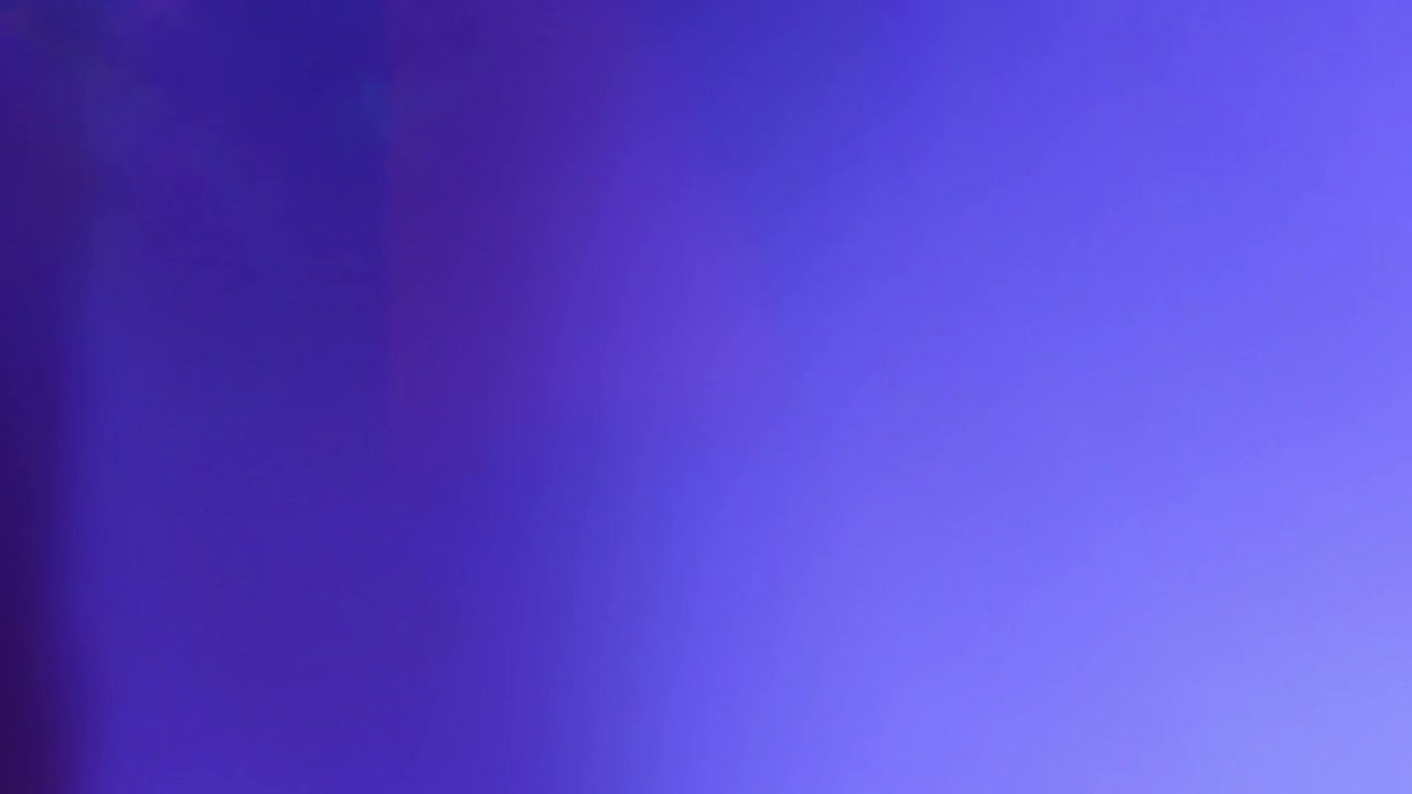 Abstract Light Leaks and Color Transitions on Dark Background
