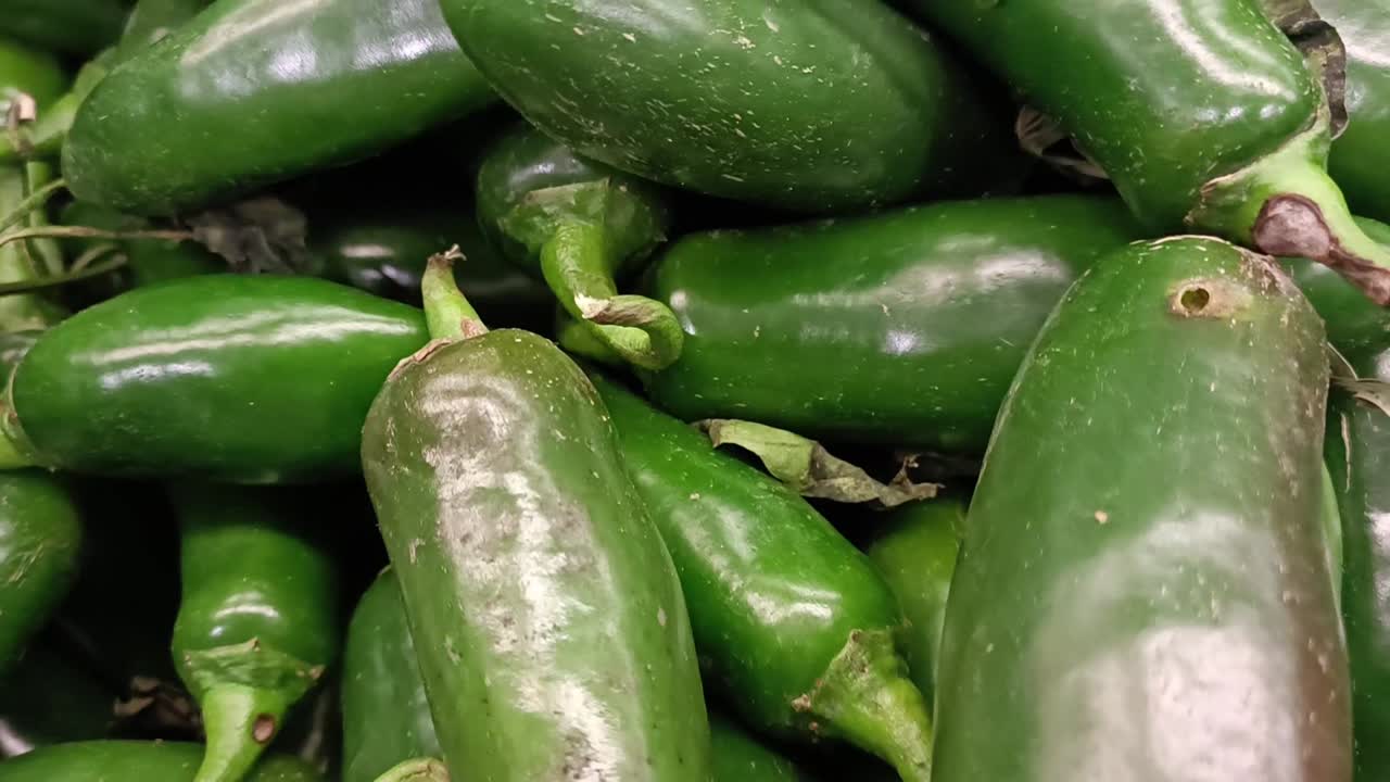 Jalape&ntilde;o chili peppers on display in a supermarket