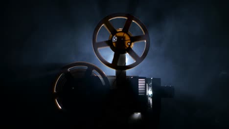 vintage film projector in smoky darkness