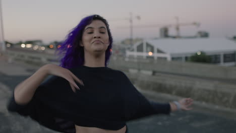 dancing-woman-beautiful-street-dancer-with-colorful-hair-performing-contemporary-hip-hop-moves-enjoying-modern-dance-expression-in-city-at-sunset