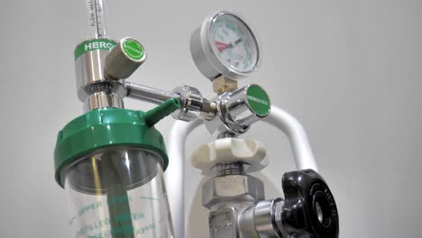 slow motion shot of collection chambers and pressure gauges on a colon hydrotherapy machine