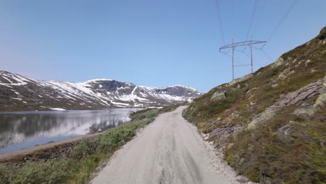 famous cycling route of rallarvegen through the hardangervidda plateau in norway. pov shot