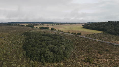 aerial view of a road through a scenic new zealand landscape