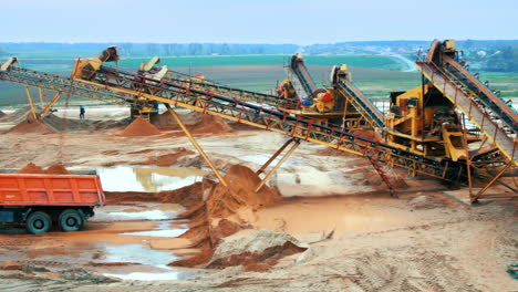 mining site with heavy industrial equipment. mining elevator with belt conveyor