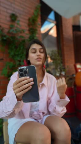 woman having a video call outdoors