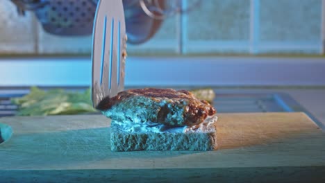 Putting-Ground-Turkey-Patty,-Green-Cabbage-Leaf,-Cherry-Tomatoes,-And-Pickles-Onto-Whole-Grain-Toast-With-Salad-Mayonnaise-Spread