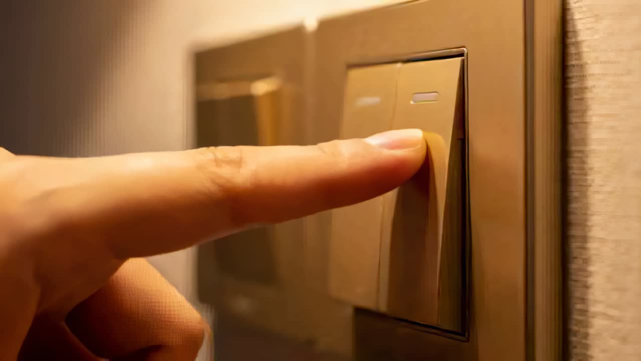 Touching finger pressing right rocker down in hall, toggling light with metal plate and left rocker