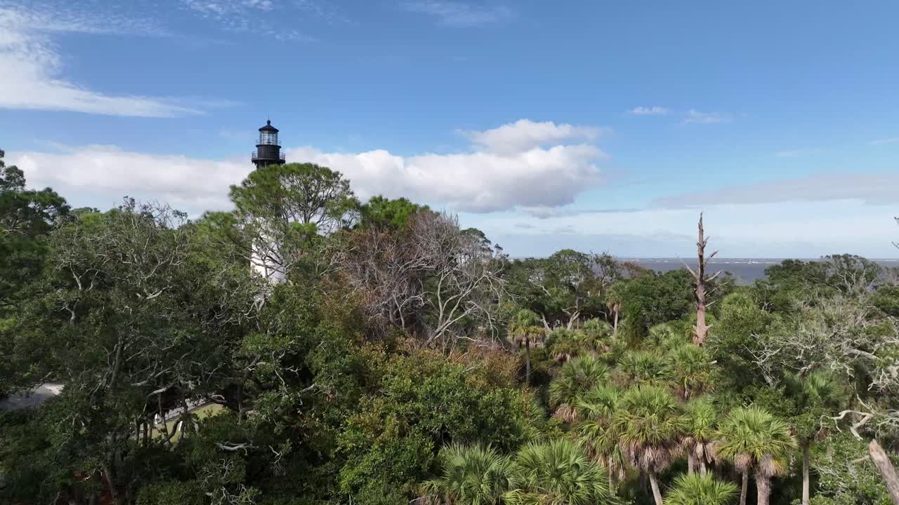 aerial rise from hunting island beach lighthouse in south carolina
