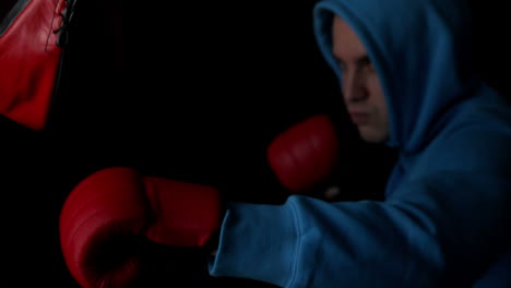 Tough-boxer-punching-with-red-gloves