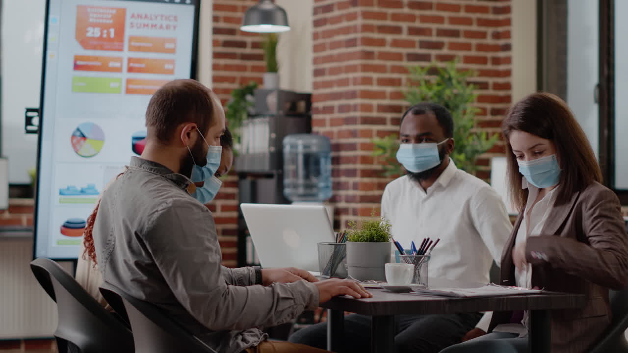Team of diverse coworkers arriving at business meeting in office