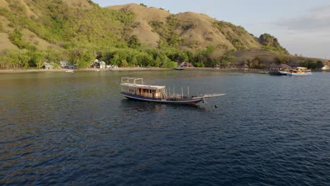 komodo aerial of the beach and reef on a hot sunny day at sunset