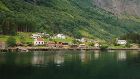 A-Picturesque-Village-With-Traditional-Wooden-Houses-On-The-Shore-Of-The-Fjord-In-Norway-View-From-A