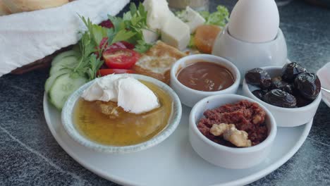 traditional turkish breakfast spread with eggs, olives, cheese, and honey