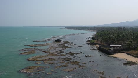 tropical coastline with shallow water and rocks