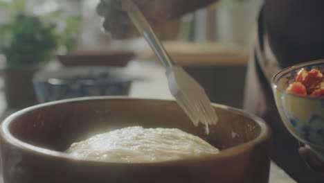 woman baking in a bright kitchen