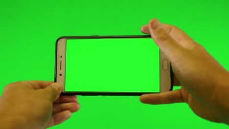 green screen tablet and green background chromakey commercial device using footage