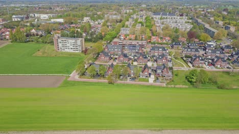 stunning aerial overview of a modern suburban neighborhood with photovoltaic solar panels on rooftops