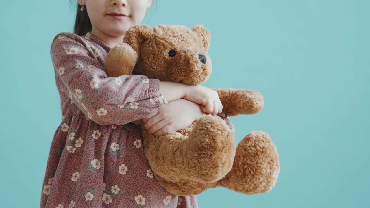 Slowmo of Little Girl Hugging Plushy