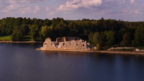 aereal panning view of the old ancient ruins of a castle in koknese.