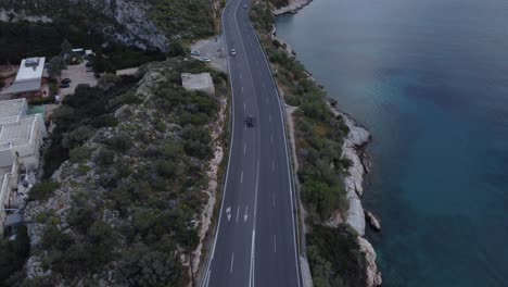 Drone-footage-above-Athenian-riviera-|-Highway-by-the-sea-in-Vouliagmeni-area-in-Athens-near-lake-Vouliagmeni-|-4K