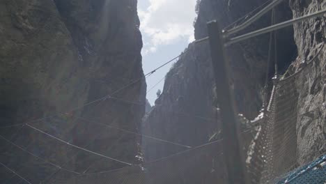 sunlight above wooden net structure in cave | grindelwald switzerland cave in glacier canyon, europe, 4k