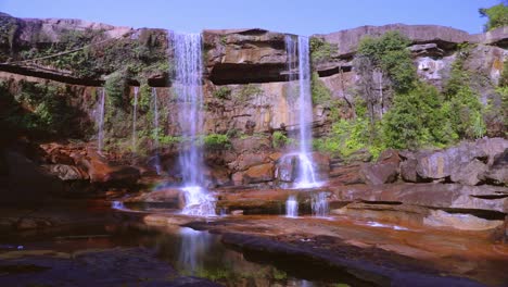 pristine natural waterfall falling from mountain top at day from low angle video is taken at phe phe fall meghalaya india