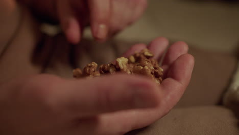 man eating walnuts