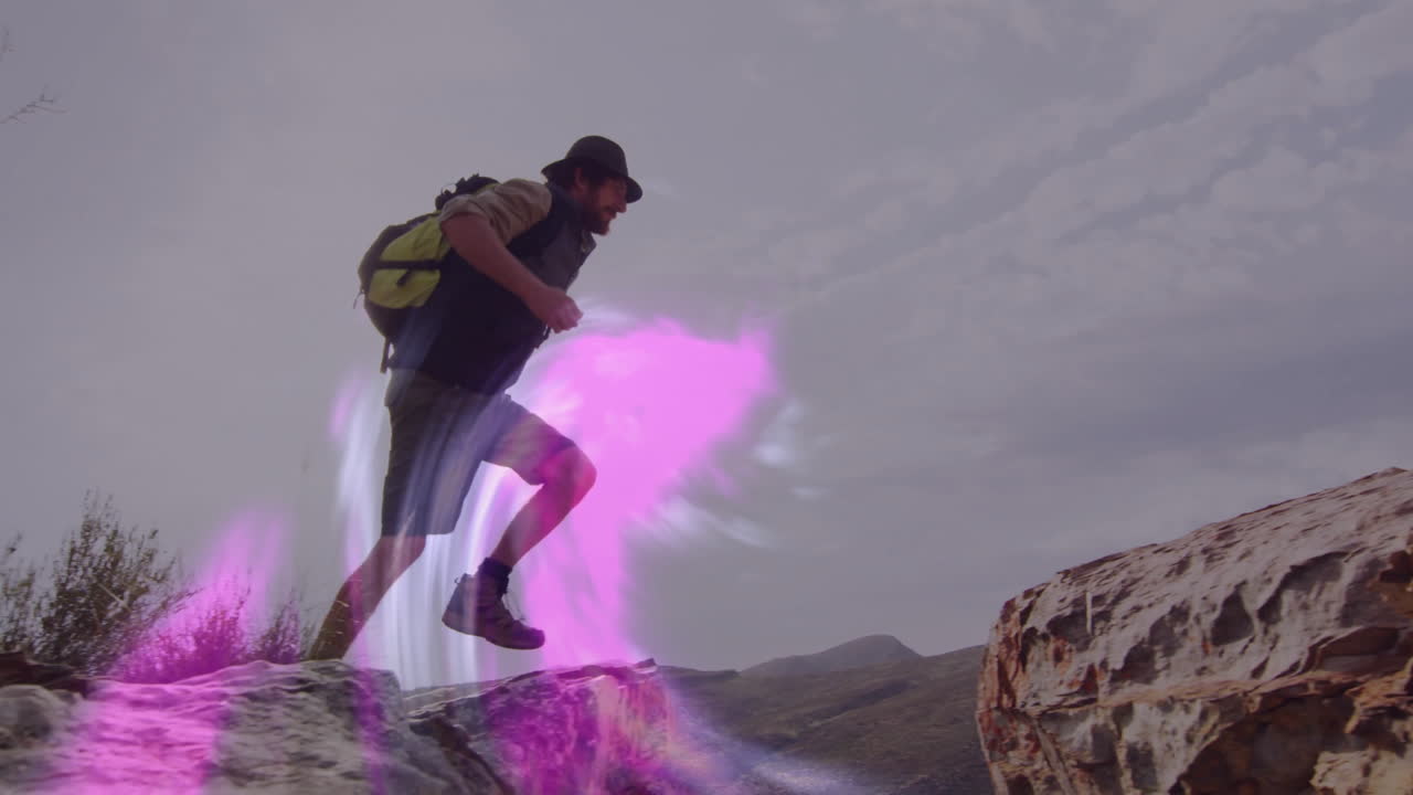 male hiker stepping up onto rocky outcrop, with translucent energy glow overlay for travel ad