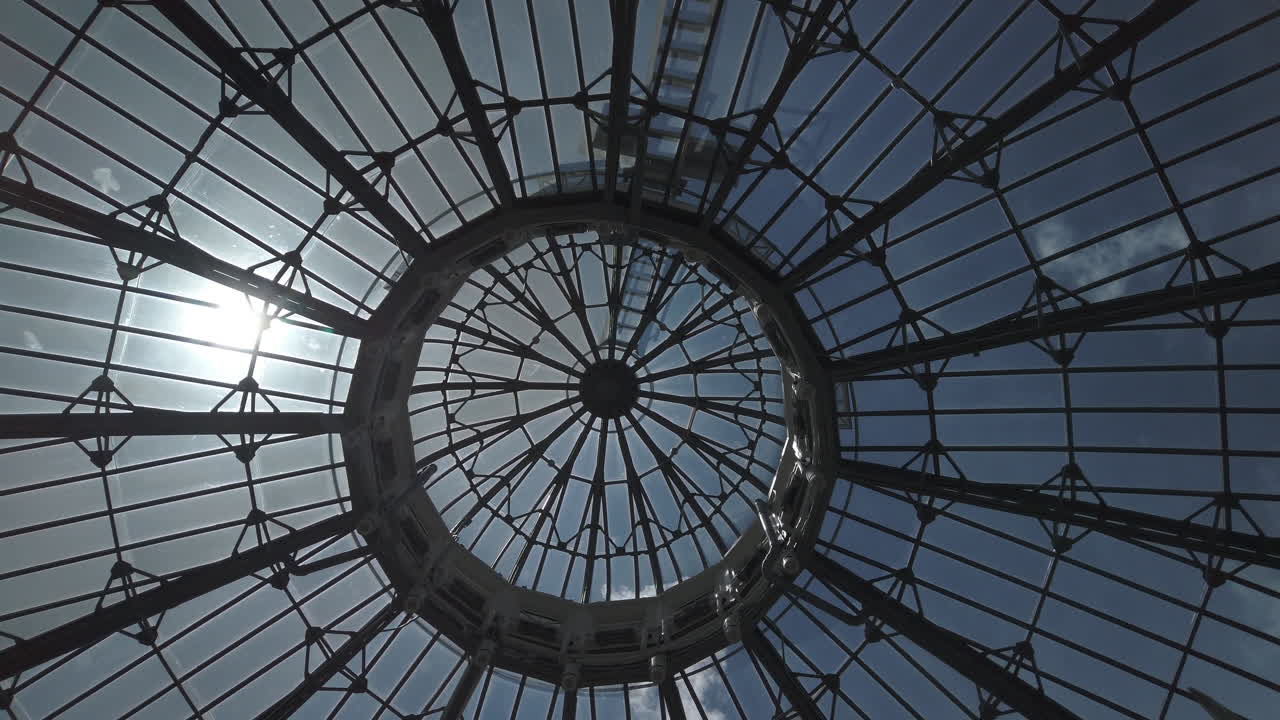 Circular view looking upwards at the glass dome in Allan Gardens, rotating wide shot