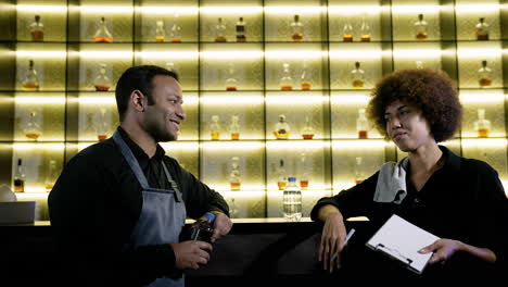 bartenders working in the pub