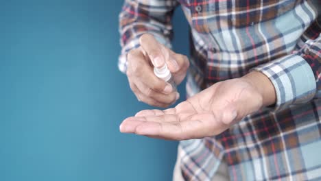 person applying hand sanitizer