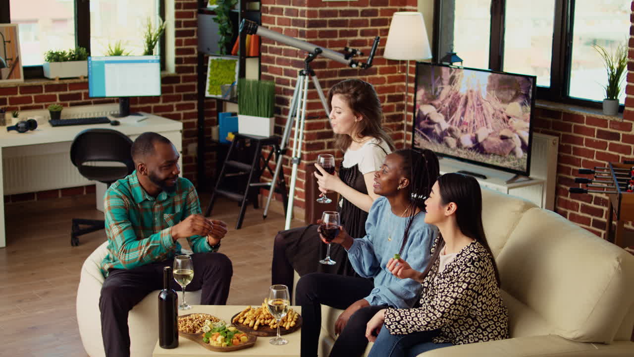 BIPOC group of friends discussing at home, catching up