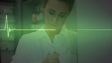animation of cardiograph over caucasian female making medicine