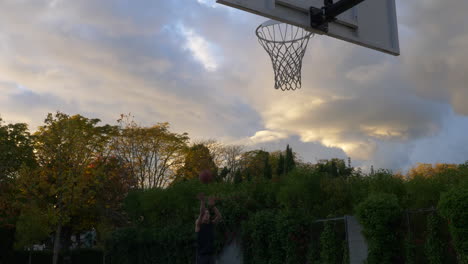 young basketball players dribble and shooting into the net by layup during a practice session